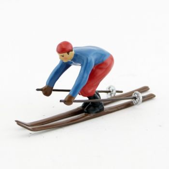 Skieur, ann&eacute;es 20, blouson bleu et pantalon rouge