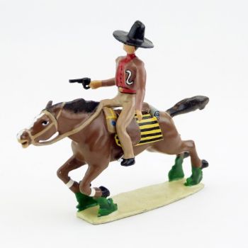 Cavalier mexicain avec revolver sur cheval au galop