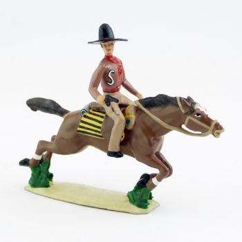 Cavalier mexicain avec revolver sur cheval au galop