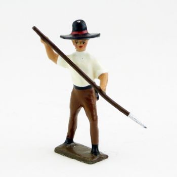 Mexicain plantant sa lance vers le sol