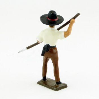 Mexicain plantant sa lance vers le sol