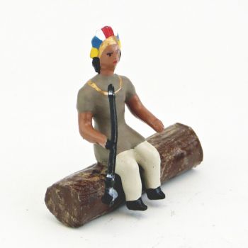 indien assis sur tronc d'arbre avec calumet